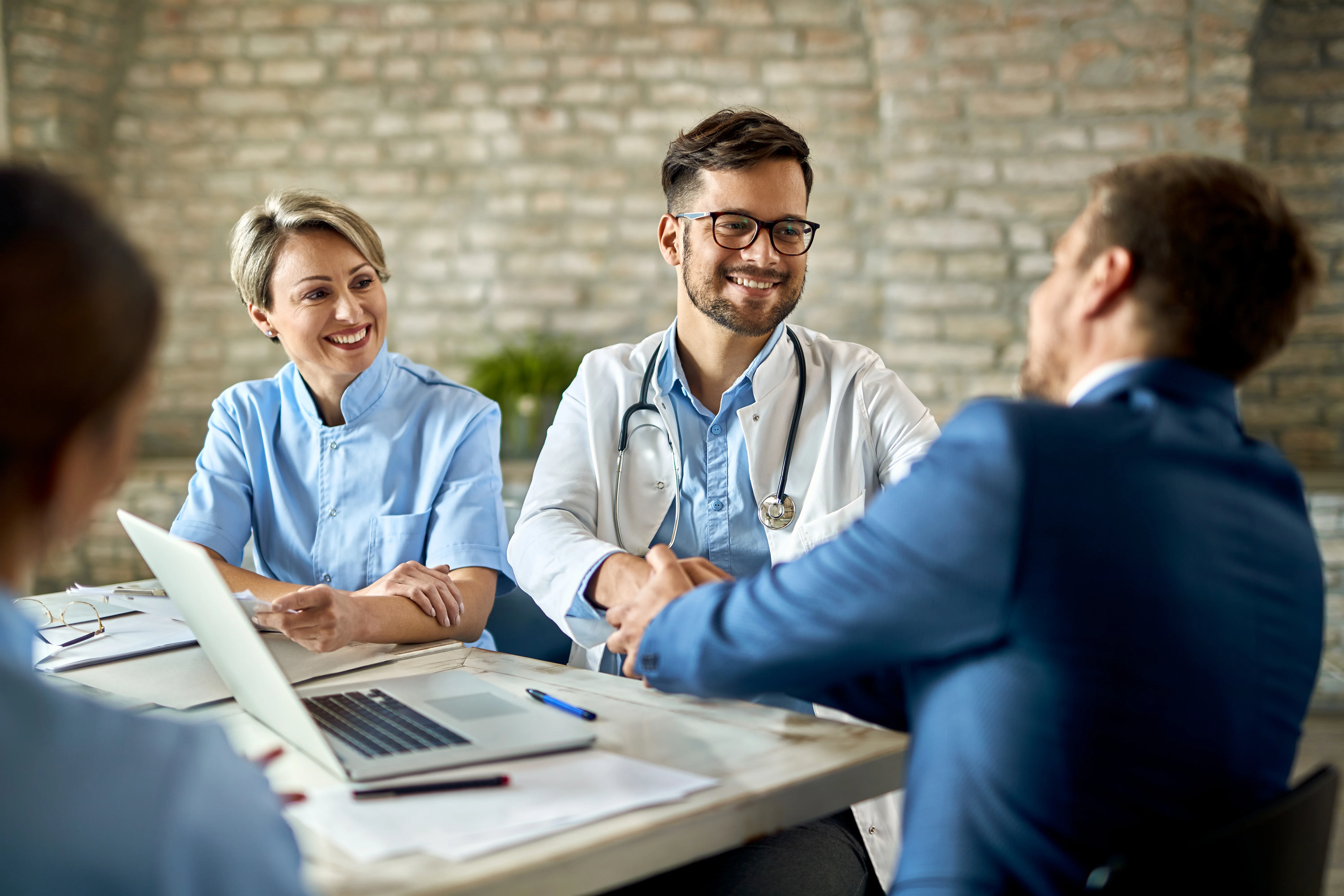 clients speaking with insurance broker to understand aca marketplace rules