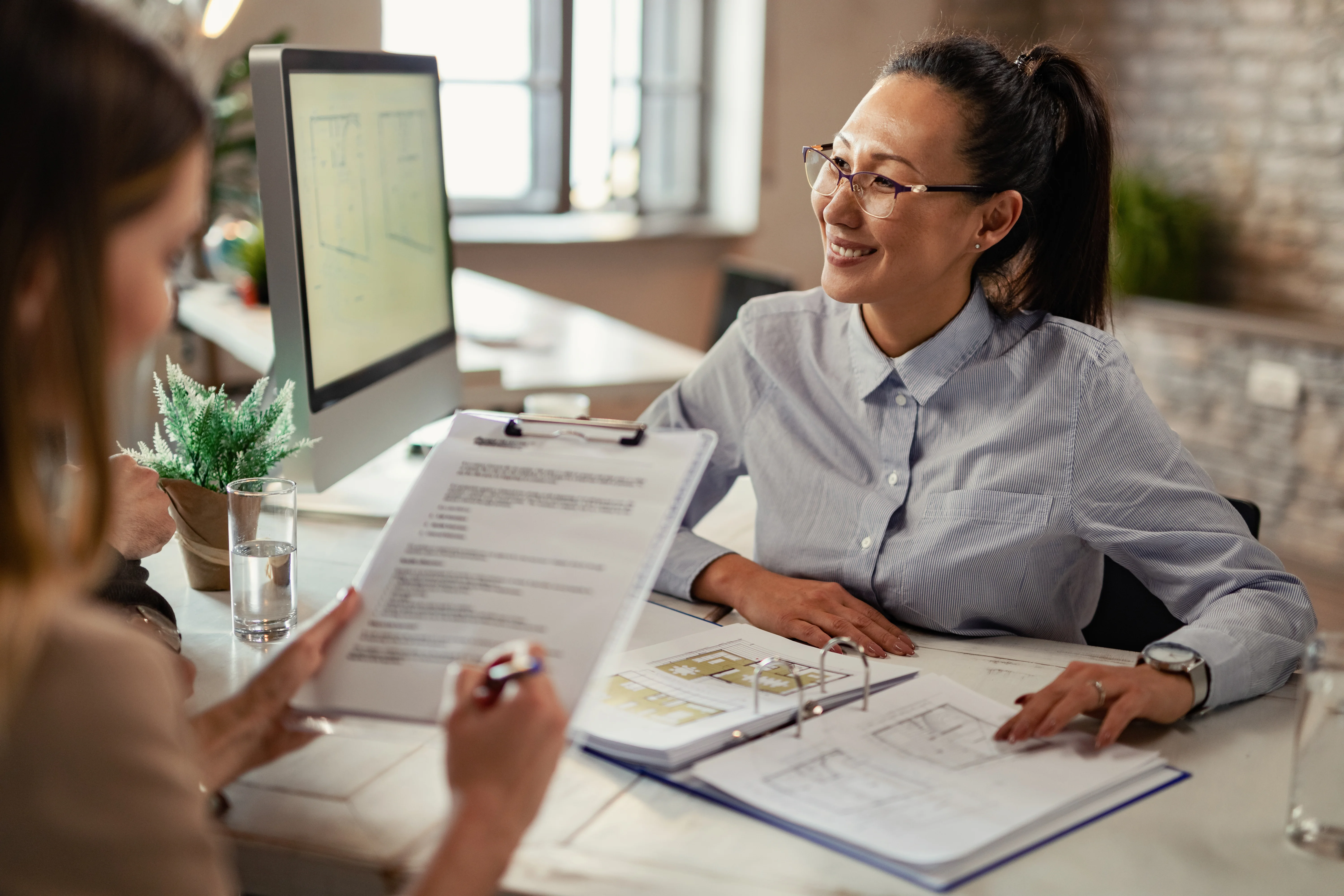 Insurance advisor meeting with a client to discuss health coverage options