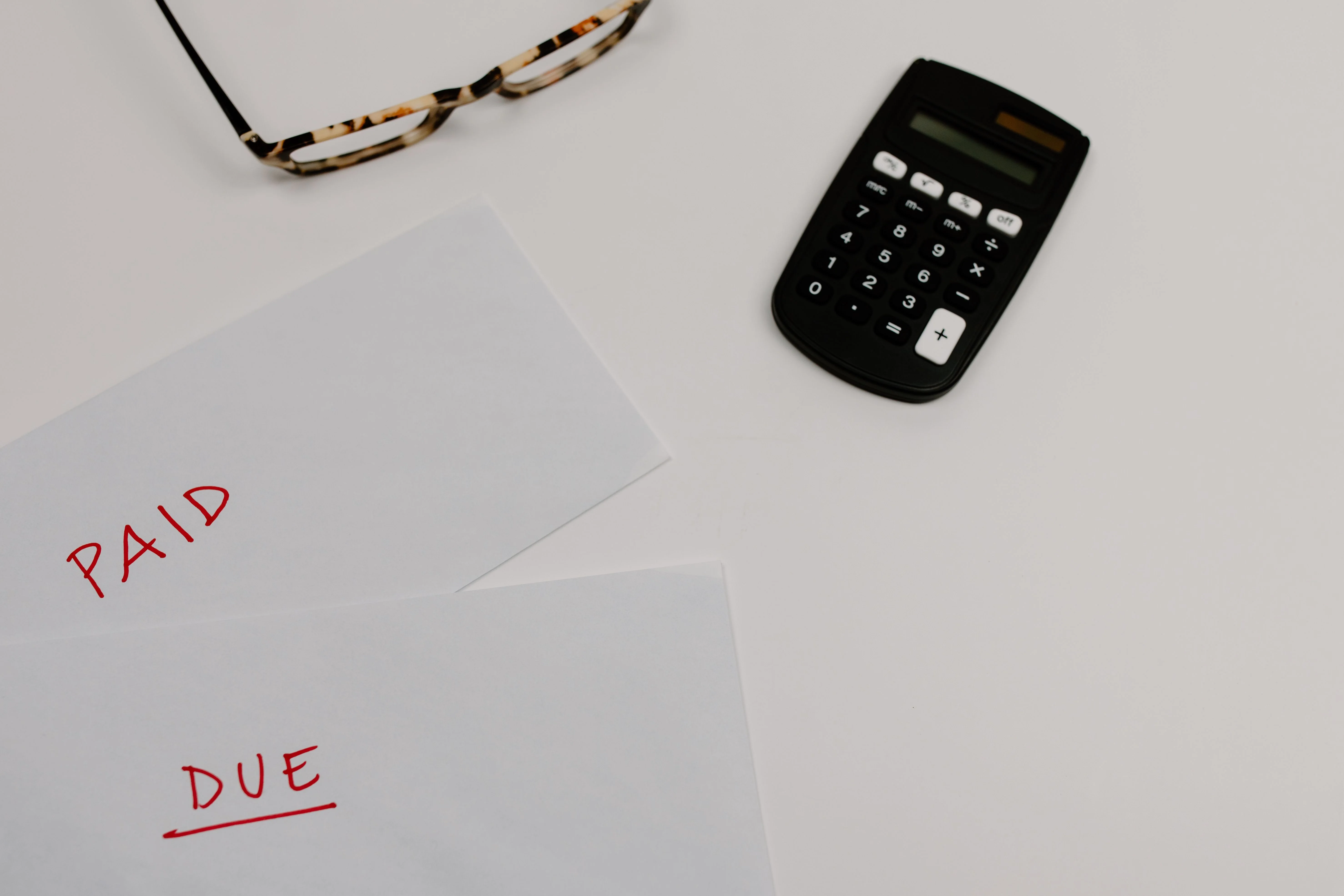Paid and unpaid medical bills with a calculator for tracking healthcare expenses