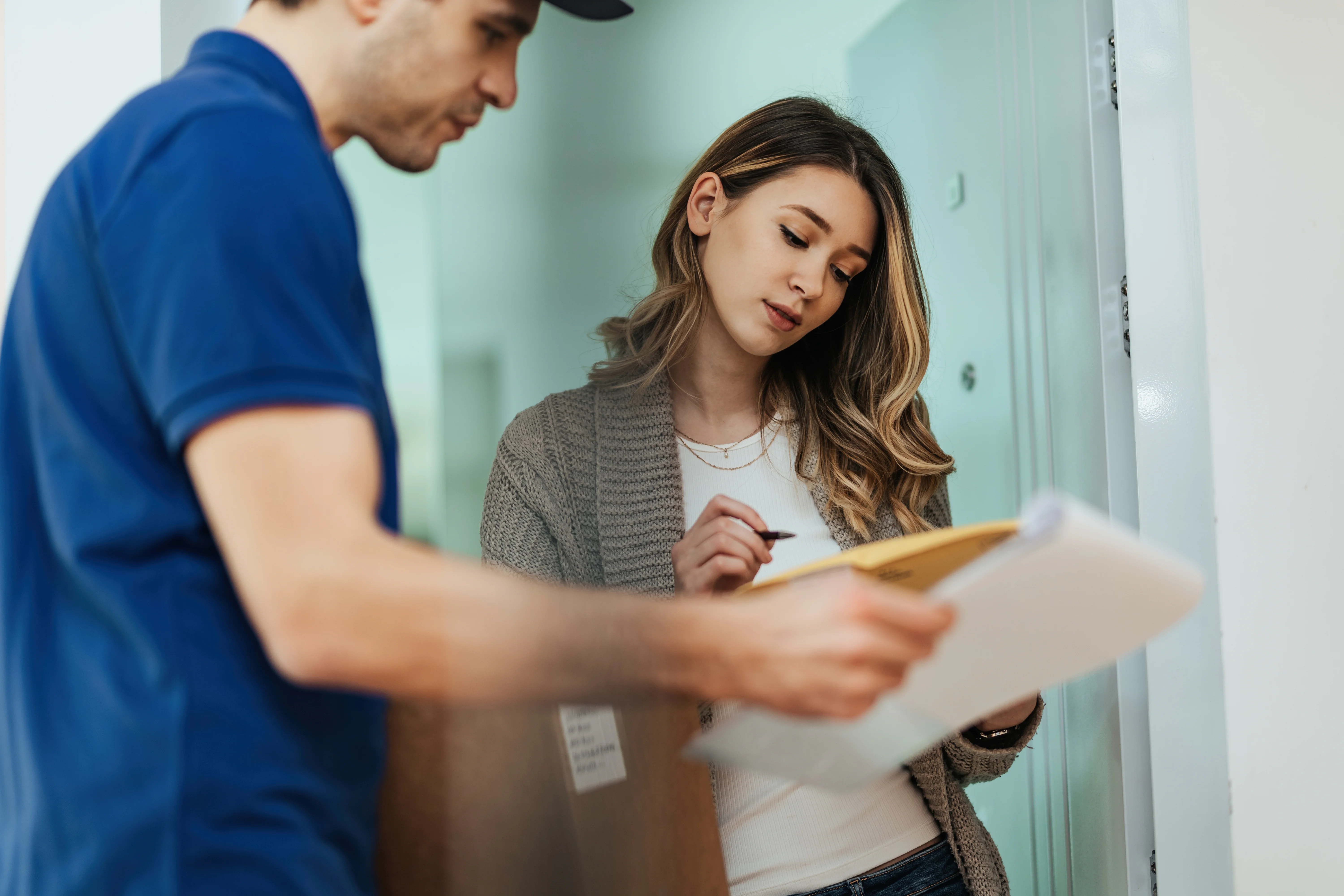 Woman completing paperwork after moving to a new home